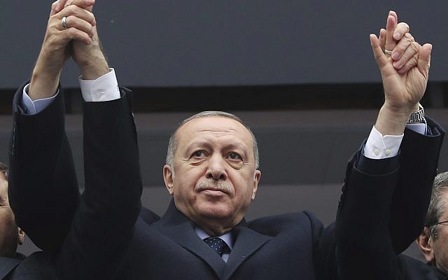 Turkey President Recep Tayyip Erdogan waves to supporters during a rally, February 26, 2019. (Presidential Press Service via AP, Pool)