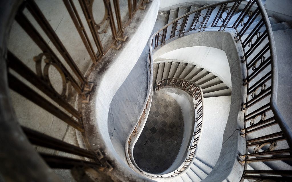 This Tuesday, Feb. 22, 2019 photo shows the stair case inside the abandoned "Haus der Offiziere", the headquarters for the Soviets' military high command in former East Germany, at the Wuensdorf neighborhood of Zossen, some 40 kilometers (25 miles) south of Berlin. (AP/Markus Schreiber)