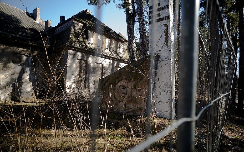 In this Tuesday, Feb. 22, 2019 photo, a monument of the Soviets' stands in front of a abandoned house at the compound of the headquarters for the Soviets' military high command in former East Germany at the Wuensdorf neighborhood of Zossen, some 40 kilometers (25 miles) south of Berlin. (AP/Markus Schreiber)