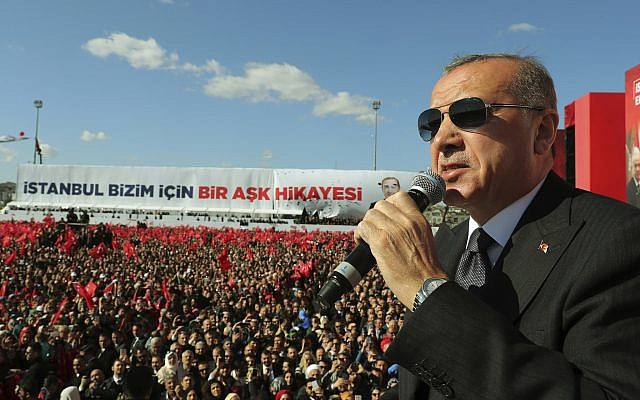 Turkey's President Recep Tayyip Erdogan addresses the supporters of opposition Nationalist Movement Party, MHP, and ruling Justice and Development Party, AKP, during a joint rally in Istanbul, March 24, 2019. (Presidential Press Service via AP, Pool)