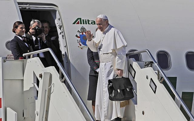 Pope Francis waves as he boards the airplane for Rabat, Morocco at Rome's Fiumicino International airport, Saturday, March 30, 2019 (AP Photo/Alessandra Tarantino)