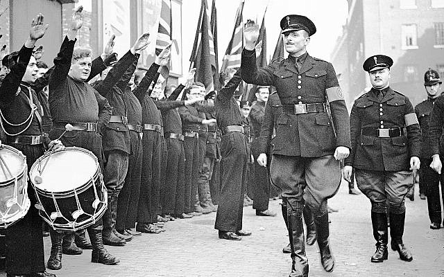 Sir Oswald Mosley, leader of the British Union of Fascists, inspects the ranks of blackshirts, in East London, on October 4, 1936. (AP Photo/Len Puttnam/Staff)