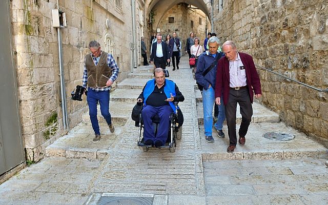 A wheelchair user tries out the newly accessible streets in Jerusalem's Old City, part of a NIS 20 million ($5.5 million) project along four kilometers of Old City streets (Courtesy City of Jerusalem)