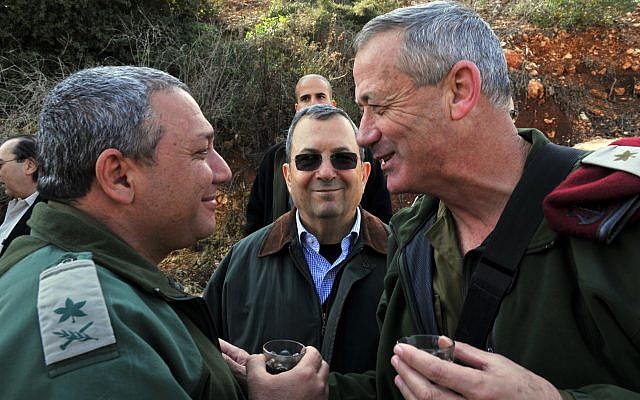 Then-defense minister Ehud Barak (center), then-IDF chief of staff Benny Gantz (right),  and Gantz's later successor in the role, Gadi Eisenkot, pictured near the northern border on February 15, 2011. (Defense Ministry/ Flash90/ File)