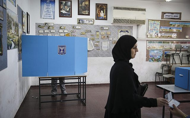 Illustrative: Arab-Israeli citizens cast their votes at a polling station in Ramla on elections day for the 20th Knesset, March 17, 2015. (Hadas Parush/Flash90)