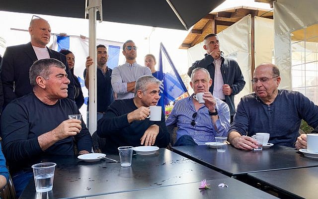 Left to right: Blue and White party leaders Gabi Ashkenazi, Yair Lapid, Benny Gantz and Moshe Ya'alon visit a shopping center in the southern port city of Ashdod on March 8, 2019. (Flash90)