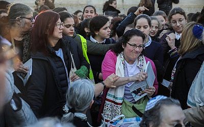 Members of the Women of the Wall prayer group hold prayers as thousands of ultra-Orthodox women protest against them at the Western Wall in the Old City of Jerusalem on March 8, 2019. (Hadas Parush/Flash90)