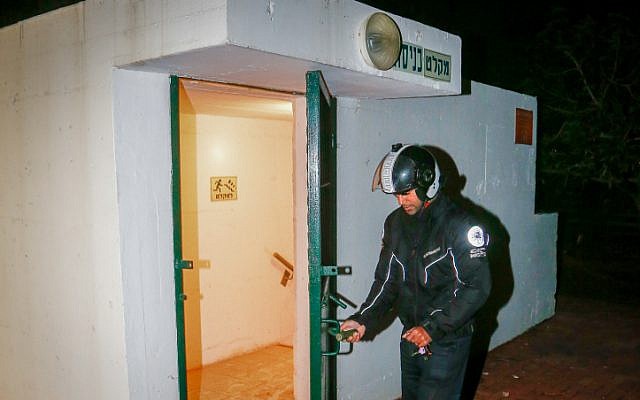 Tel Aviv municipality worker opens the door of a bomb shelter in Tel Aviv on March 25, 2019. (Roy Alima/Flash90)