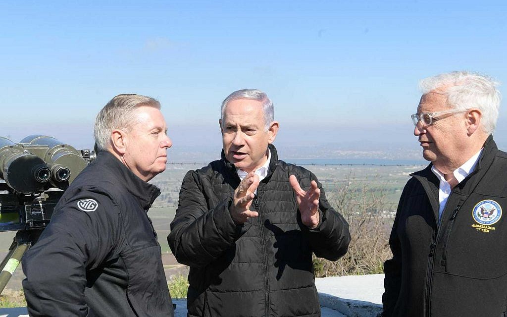 US Senator Lindsey Graham, left, Prime Minister Benjamin Netanyahu, center, and US Ambassador to Israel David Friedman, right, on a tour of the Golan Heights, March 11, 2019. (Amos Ben Gershom/GPO)