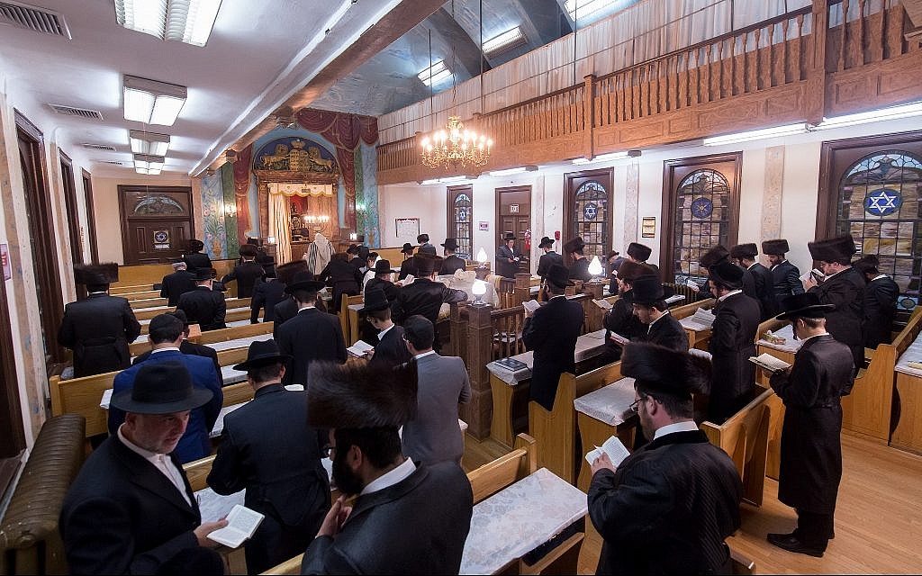 Congregants praying in Chevra Anshei Lubawitz in Borough Park, New York, before the synagogue was closed. (Courtesy David Shor)