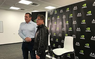 Eyal Waldman, left, founder and CEO of Mellanox, and Jensen Huang, the founder and CEO of Nvidia Corp., at a press conference in Yokne'am, Israel, on March 25, 2019 (Shoshanna Solomon/Times of Israel)