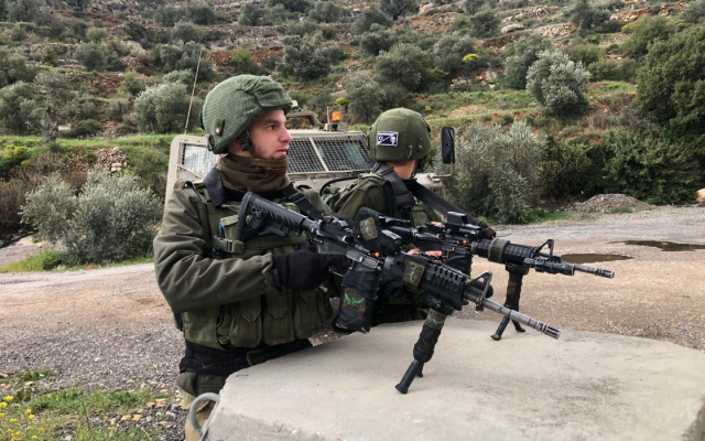 Illustrative. IDF soldiers near the scene of a shooting attack near the northern West Bank Ariel Junction on March 17, 2019. (Israel Defense Forces)