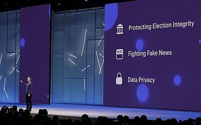 Facebook CEO Mark Zuckerberg makes the keynote address at F8, Facebook's developer conference in San Jose, Calif, on May 1, 2018. Facebook says it’s expanding its fact-checking program to include photos and videos as it fights fake news and misinformation on its service. (AP Photo/Marcio Jose Sanchez, File)