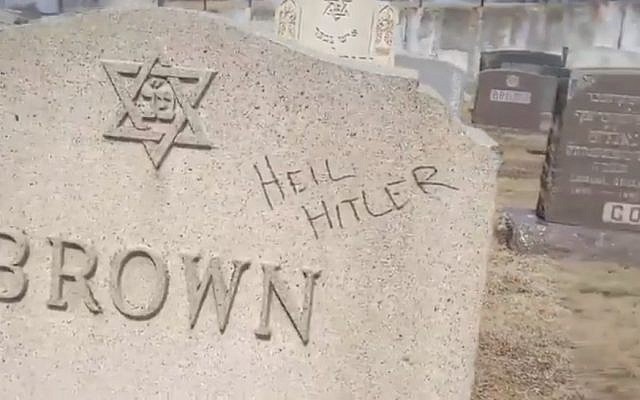 A defaced gravestone at a Jewish cemetery in Fall River, Massachusetts, in a video published on March 20, 2019. (screen capture: Washington Post)