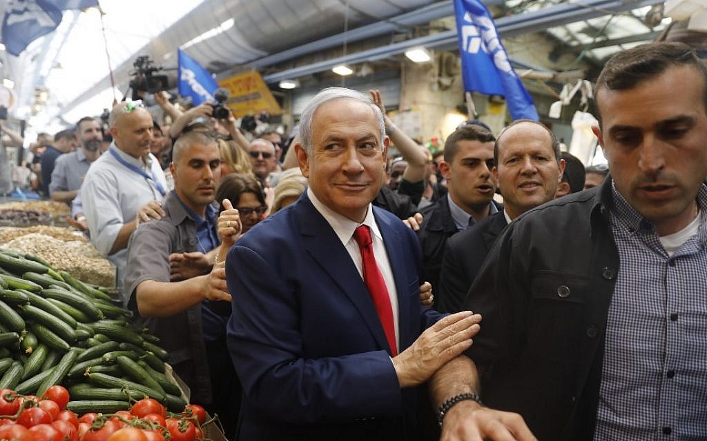 Prime Minister Benjamin Netanyahu, leader of the Likud party, walks through the Mahane Yehuda market in Jerusalem on April 8, 2019, a day ahead of Israel's parliamentary elections. (Menahem Kahana/AFP)