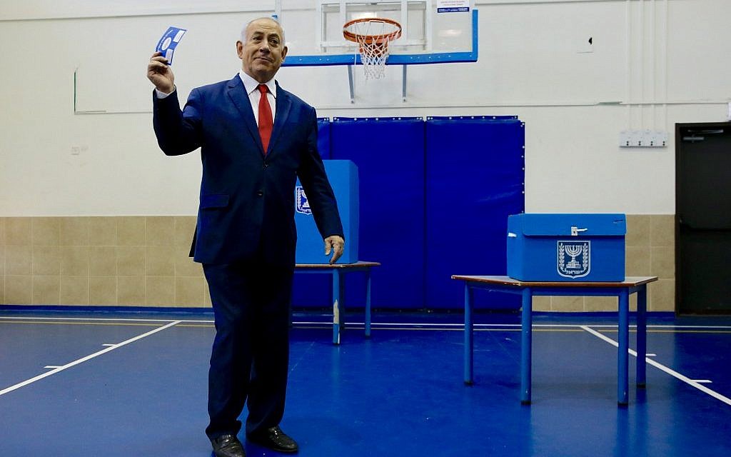 Israeli Prime Minister Benjamin Netanyahu casts his vote during Israel's parliamentary elections in Jerusalem, on April 9, 2019. (Ariel Schalit / POOL / AFP)