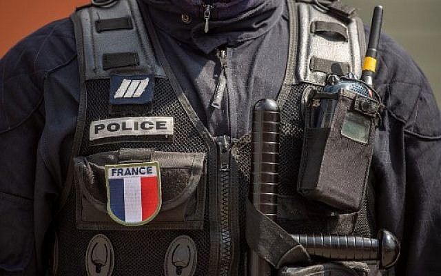 Illustrative. A French policeman standing with his equipment, April 12, 2019. (Christophe SIMON / AFP)