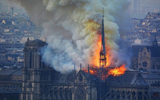 Smoke and flames rise during a fire at the Notre Dame Cathedral in central Paris on April 15, 2019. (Hubert Hitier/AFP)