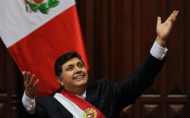 In this file picture taken on July 28, 2009 Peruvian President Alan Garcia gestures at the crowd after delivering a speech for the country's 188th independence anniversary, at the National Congress in Lima. (Ernesto Benavides/AFP)