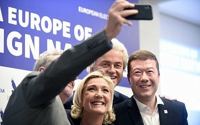 Gerolf Annemans, Belgian MEP; Marine Le Pen, head of French far-right National Front party; Dutch politician Geert Wilders of the PVV party; and Tomio Okamura, leader of Czech Freedom and Direct Democracy party take a selfie after their press conference during a conference of the right-wing Europe of Nations and Freedom (ENF) group in the European Parliament on April 25 , 2019, in Prague. (AFP/Michal Cizek)
