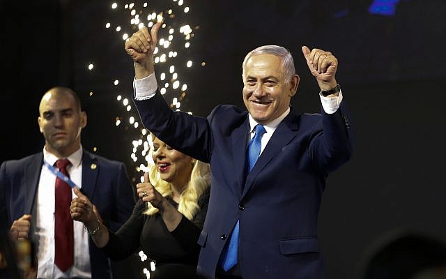 Israel’s Prime Minister Benjamin Netanyahu waves to his supporters, after polls for Israel’s general elections closed in Tel Aviv, on April 10, 2019. (AP Photo/Ariel Schalit)