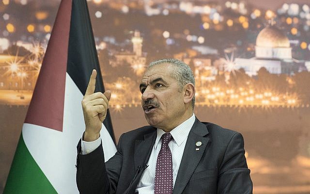 Palestinian Authority Prime Minister Mohammad Shtayyeh talks during an interview with The Associated Press, at his office in the West Bank city of Ramallah, Tuesday, April 16, 2019. (AP Photo/Nasser Nasser)