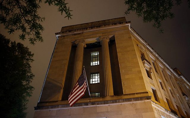 An American flag flies outside the Department of Justice on April 18, 2019, in Washington. (AP Photo/Patrick Semansky)