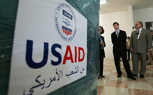 US consul general in Jerusalem Jacob Walles (2nd R) looks at USAID donations donated to the Palestinians in the west Bank town of Ramallah on May 10, 2006. (AP Photo/Muhammed Muheisen)