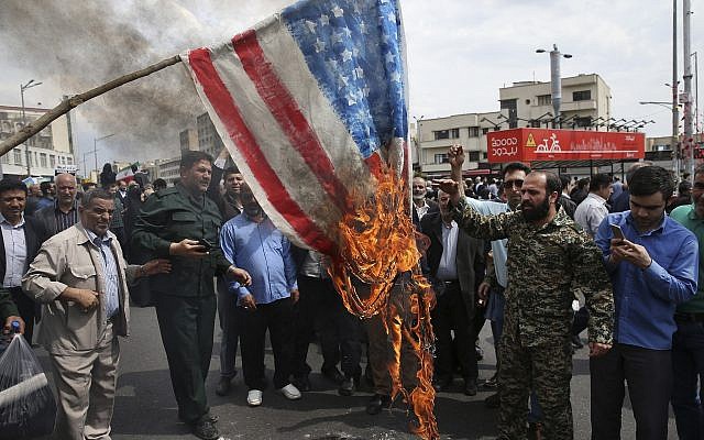Protesters burn a representation of the American flag during a rally against the US's decision to designate Iran's powerful Revolutionary Guards as a foreign terrorist organization, after their Friday prayers at the Enqelab-e-Eslami (Islamic Revolution) square in Tehran, Iran, on April 12, 2019. (AP/Vahid Salemi)