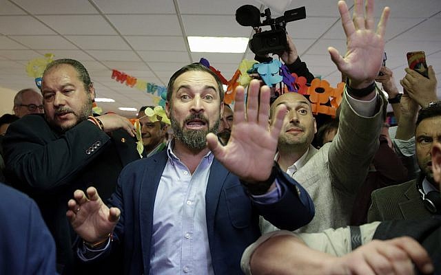 Santiago Abascal, center, leader of far right party Vox, gestures after casting his ballot at a polling station for Spain's general election in Madrid, Sunday, April 28, 2019. (AP Photo/Andrea Comas)