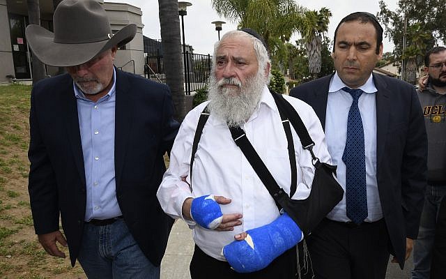 Rabbi Yisroel Goldstein, center, arrives for a news conference at the Chabad of Poway synagogue, Sunday, April 28, 2019, in Poway, Calif. A man opened fire Saturday inside the synagogue near San Diego as worshippers celebrated the last day of a major Jewish holiday. (AP Photo/Denis Poroy)