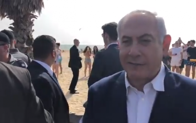 Prime Minister Benjamin Netanyahu in a campaign video filmed at a beach in the coastal city of Netanya on election day, April 9, 2019. (Screen capture: Twitter)