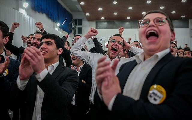 Supporters of the ultra-Orthodox Shas party celebrate at its Jerusalem headquarters after the publication of exit polls on April 9, 2019. (Flash90)