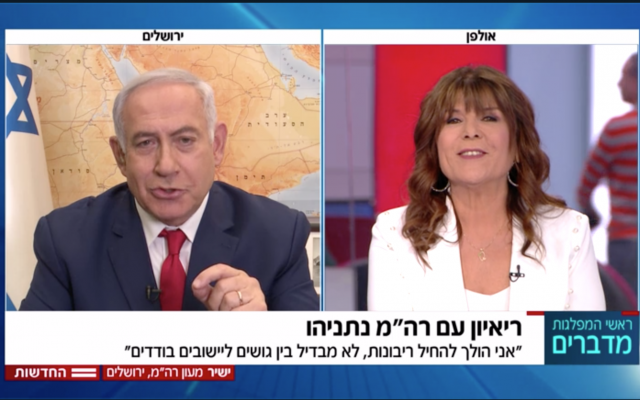 Prime Minister Benjamin Netanyahu promises in a Channel 12 TV interview to apply Israeli sovereignty at West Bank settlements, April 6, 2019 (Channel 12 news screenshot)