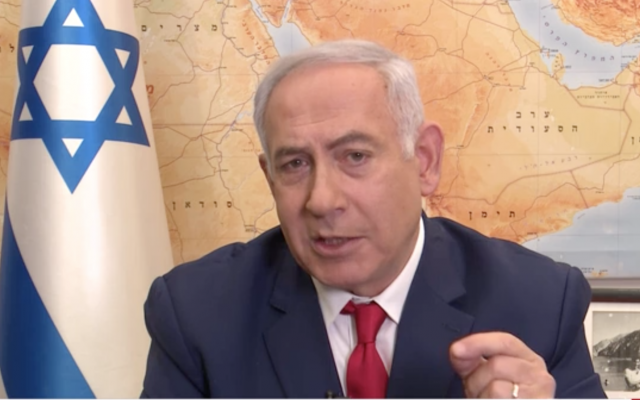 Prime Minister Benjamin Netanyahu promises in a Channel 12 TV interview to extend Israeli sovereignty to West Bank settlements, April 6, 2019 (Channel 12 news screenshot)