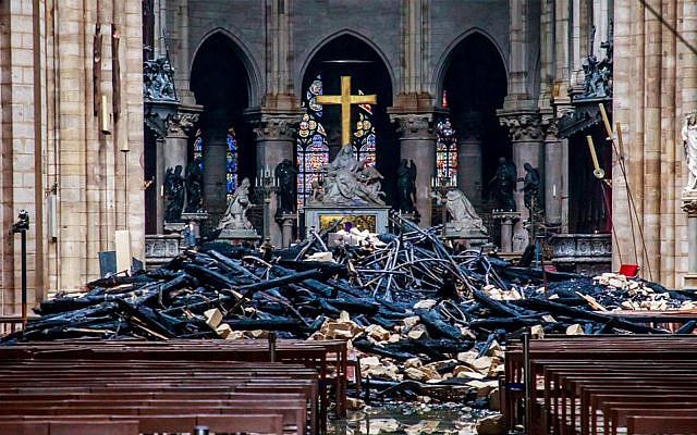 Debris inside the Notre Dame Cathedral in Paris on April 16, 2019, a day after a fire that devastated the iconic building. (Christophe Petit Tesson/POOL/AFP)