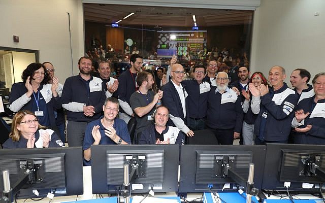 Engineers celebrate in the Beresheet control room in Yehud on April 4, 2019 after announcing the moon's gravitation pull has most likely successfully captured the Beresheet spacecraft, the most complicated maneuver that the spacecraft has executed since its launch. (Eliran Avital/courtesy Beresheet)