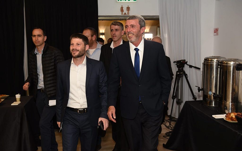 URWP leaders Rafi Peretz (L) and Bezalel Smotrich arrive at an election results party in Kfar Maccabiah on April 9, 2019. (Nachshon Pillipson)