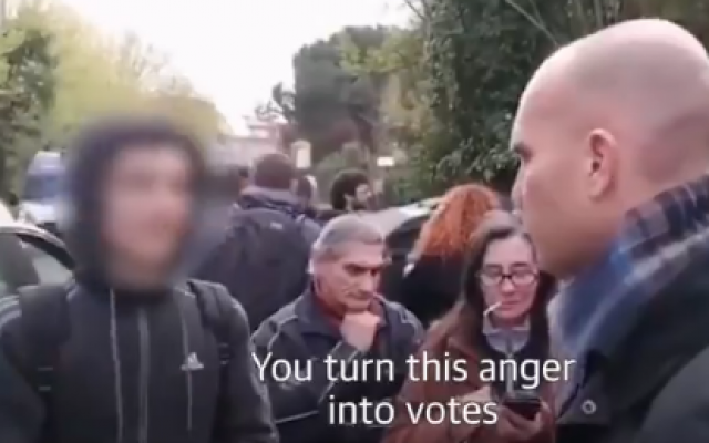 An Italian teen (L) confronts a far-right protester in the Rome suburb of Torre Maura in a video that went viral, on April 2, 2019 (screenshot)