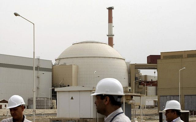 In this file photo taken on February 25, 2009, Iranian technicians walk outside the building housing the reactor of the Bushehr nuclear power plant, in the Iranian port town of Bushehr, 1,200 kilometers south of Tehran. (Behrouz Mehri/AFP Files/AFP)