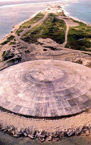 Picture taken by the US Defense Nuclear Agency in 1980, shows the huge dome built over top of a crater left by one of the 43 nuclear nuclear tests over Runit Island in Enewetak in the Marshall Islands. (GIFF JOHNSON / US DEFENCE NUCLEAR AGENCY / AFP)
