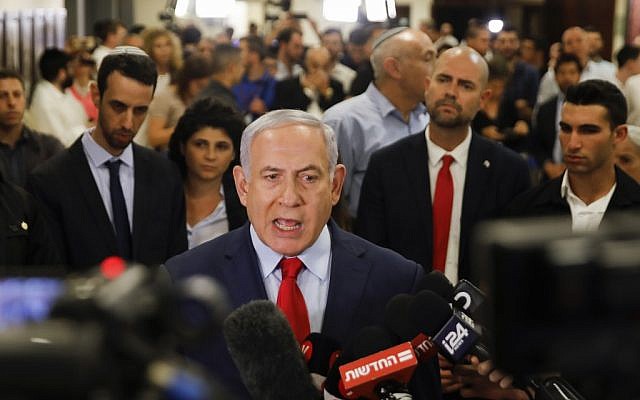 Prime Minister Benjamin Netanyahu talks to the press following a vote on a bill to dissolve the Knesset on May 29, 2019, at the Knesset in Jerusalem. (Menahem KAHANA / AFP)