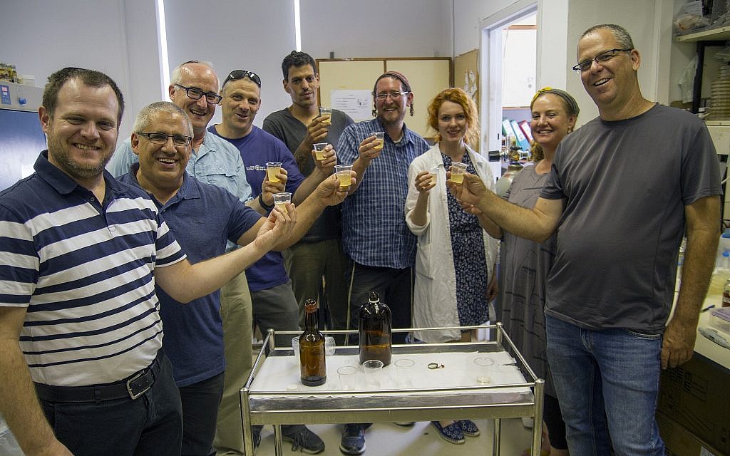Tasting the biblical-style beer produced from ancient yeast strains dormant for thousands of years. (Yaniv Berman/ Courtesy of the Israel Antiquities Authority)