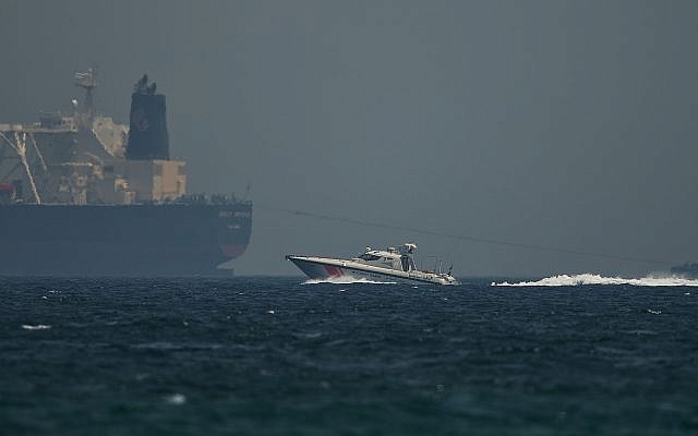 An Emirati coast guard vessel passes an oil tanker off the coast of Fujairah, United Arab Emirates, on May 13, 2019. (AP Photo/Jon Gambrell)
