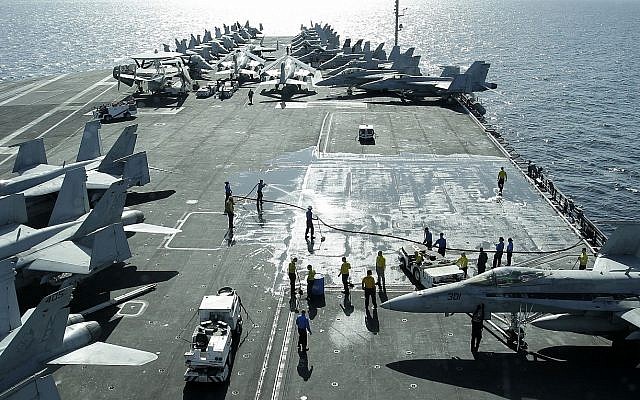 View from the bridge of the Nimitz-class aircraft carrier USS Abraham Lincoln (CVN 72) shows US jets parked on the flight deck in the Strait of Hormuz off the coast of Iran, February 15, 2012. (AP/Hassan Ammar)