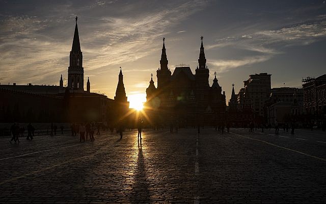People walk on Red Square enjoying a sunset in Moscow, Russia, May 16, 2019. (AP Photo/Alexander Zemlianichenko)