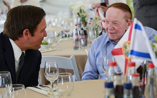 Florida Governor Ron DeSantis (L) talks to Republican donor Sheldon Adelson at a ceremony at Ariel University in the West Bank on May 27, 2019 where he was presented with the Honorary Fellowship Award for his dedication, leadership and commitment to the State of Israel (Courtesy/Governor’s Press Office)