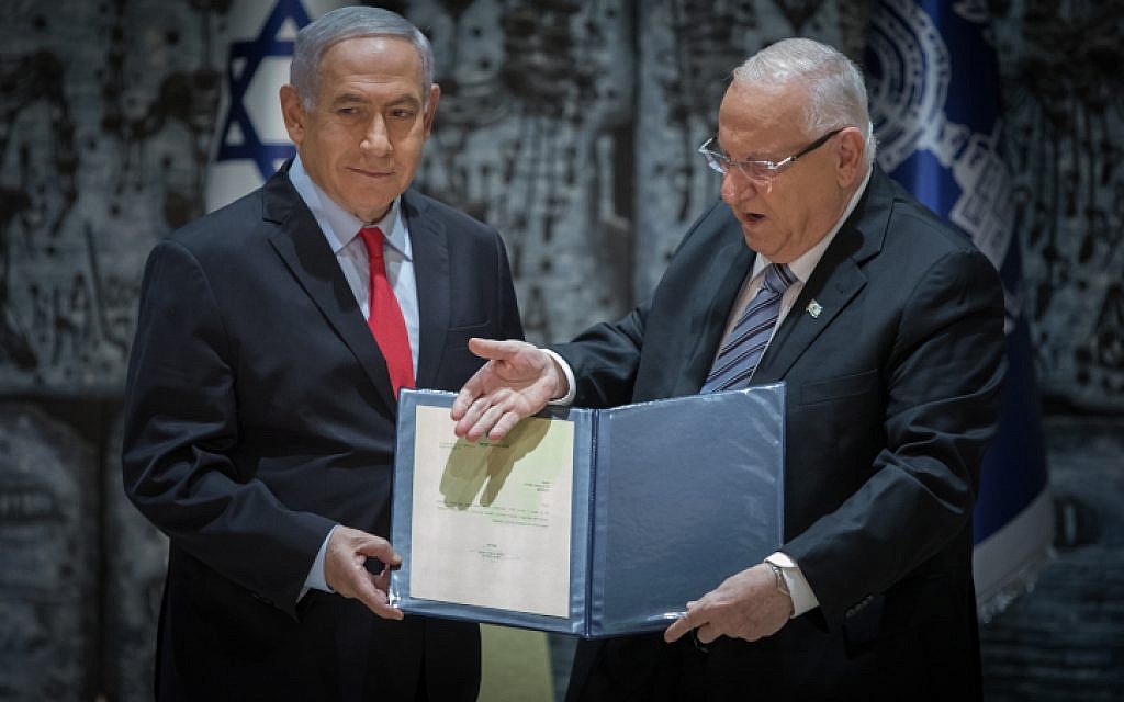President Reuven Rivlin (right) and Prime Minister Benjamin Netanyahu as Rivlin tasks Netanyahu with forming the next coalition, at the President's Residence in Jerusalem on April 17, 2019 (Noam Revkin Fenton/Flash90)