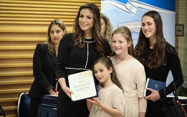 Blue and White MK Omer Yankelevich poses for a photo with her family ahead of the swearing-in of the 21st Knesset on April 30, 2019. (Noam Revkin Fenton/Flash90)