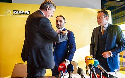 Michael Freilich, center, at a press conference in Antwerp Belgium announcing his entry into politics on January 21 2019. (Courtesy photo via JTA)